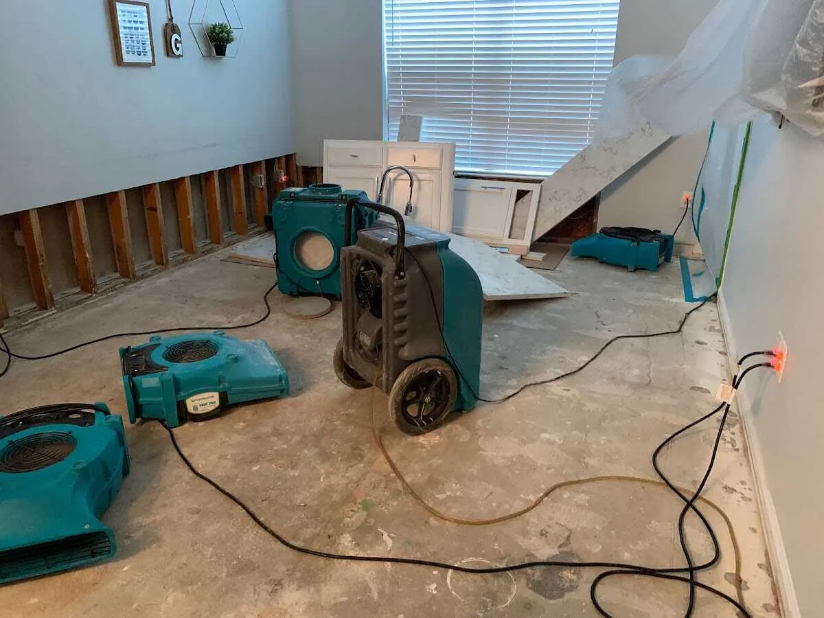 Dehumidifier in flood-cut room for Water Damage Restoration in Zebulon